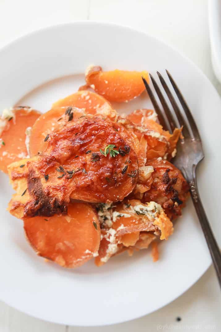 A serving of scalloped sweet potatoes on a plate.