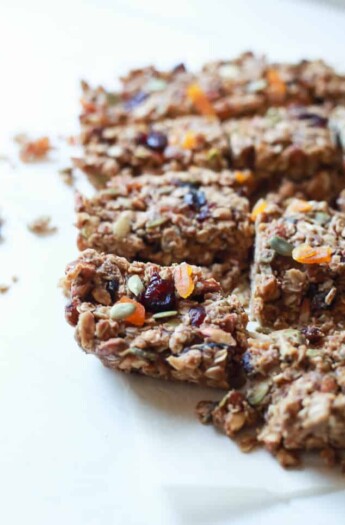 A close-up shot of homemade granola bars arranged on a white countertop