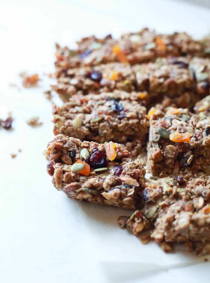 A close-up shot of homemade granola bars arranged on a white countertop