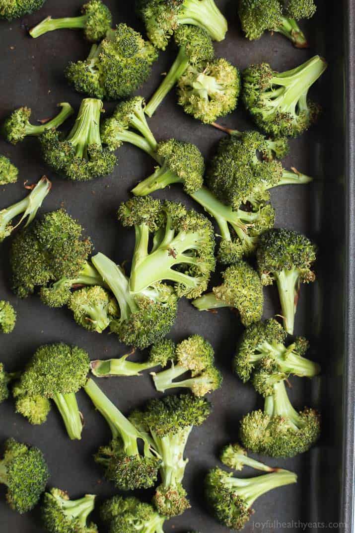 This Roasted Broccoli with Parmesan Lemon Butter Sauce is so EASY it takes 25 minutes and only 5 ingredients! The BEST broccoli you'll ever have! | joyfulhealthyeats.com