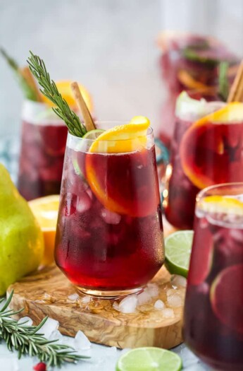 the ultimate holiday sangria recipe in a glass with ice