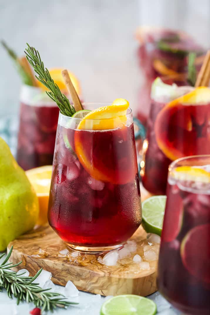 the ultimate holiday sangria recipe in a glass with ice