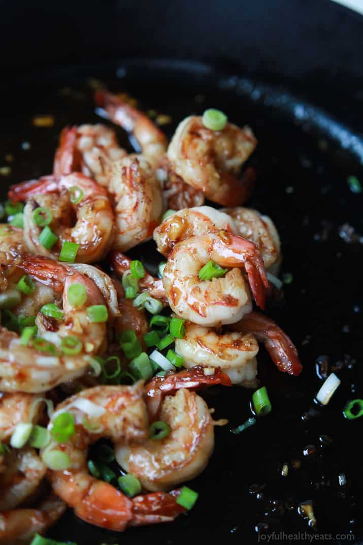 Honey Garlic Sauteed Shrimp in a cast-iron skillet