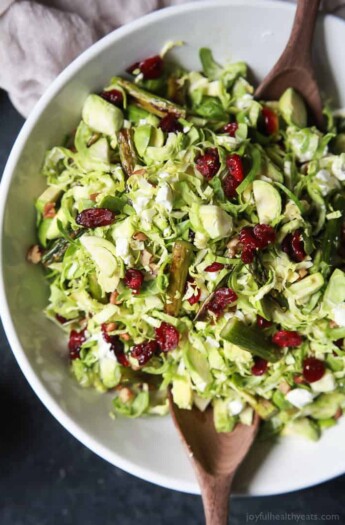 Asparagus & Brussel Sprout Salad topped with Honey Dijon Dressing - a tasty, healthy, easy to make salad done in 30 minutes that's sure to be a favorite! Perfect for the holidays or a fresh start to the new year at only 162 calories! | joyfulhealthyeats.com #glutenfree #vegetarian