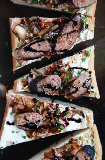 This Balsamic Italian Sausage Crostini is cut into triangles and topped with pan-seared Italian Sausage, whipped Goat Cheese, and balsamic relish | joyfulhealthyeats.com