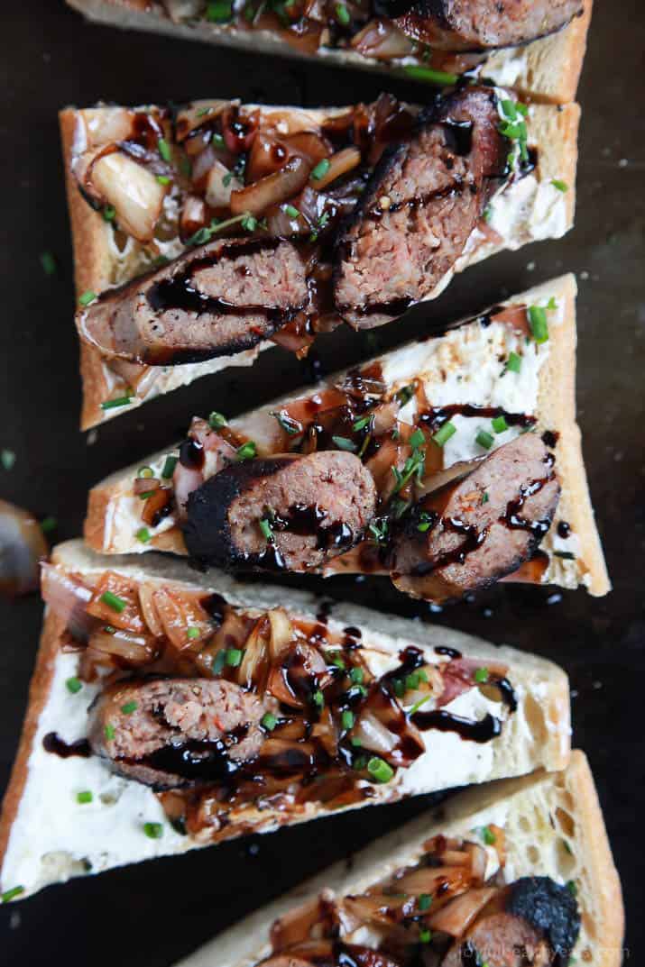 This Balsamic Italian Sausage Crostini is cut into triangles and topped with pan-seared Italian Sausage, whipped Goat Cheese, and balsamic relish | joyfulhealthyeats.com