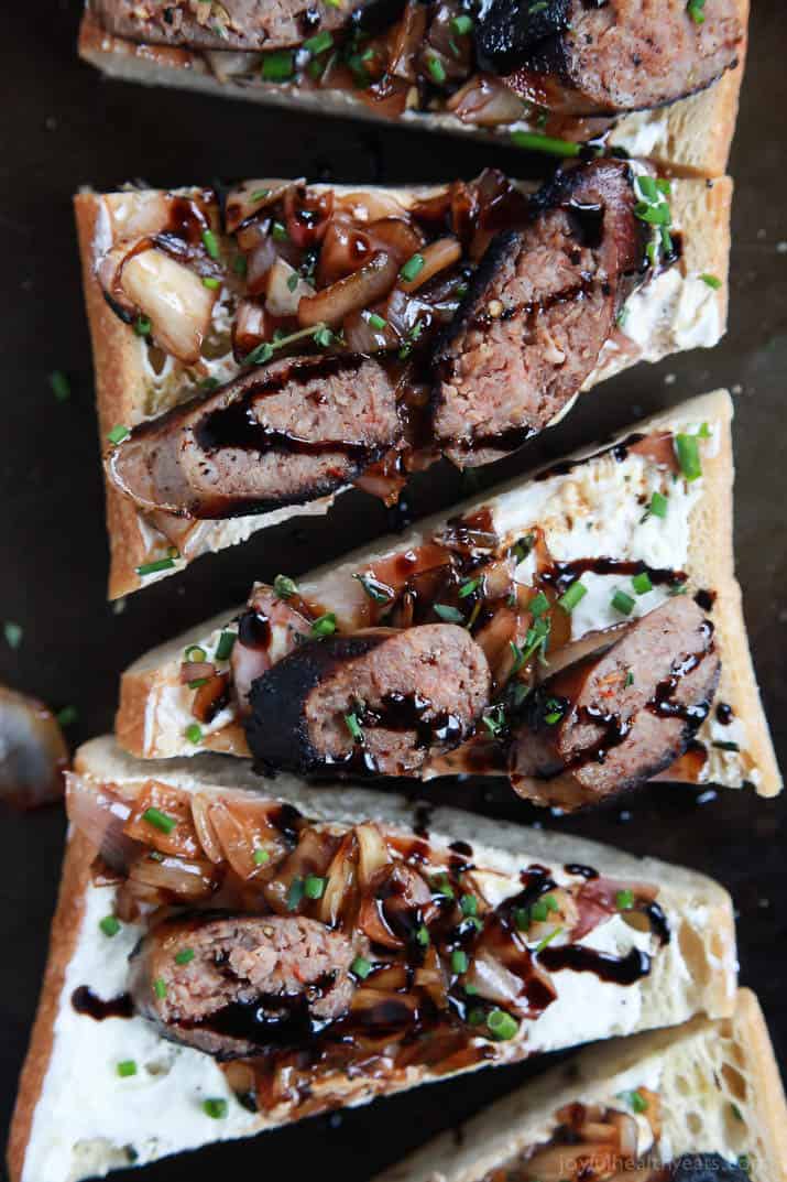Balsamic Italian Sausage Crostini topped with Whipped Goat Cheese