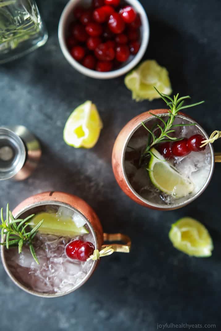 Top view of two mugs of Cranberry Moscow Mule with Rosemary Infused Vodka