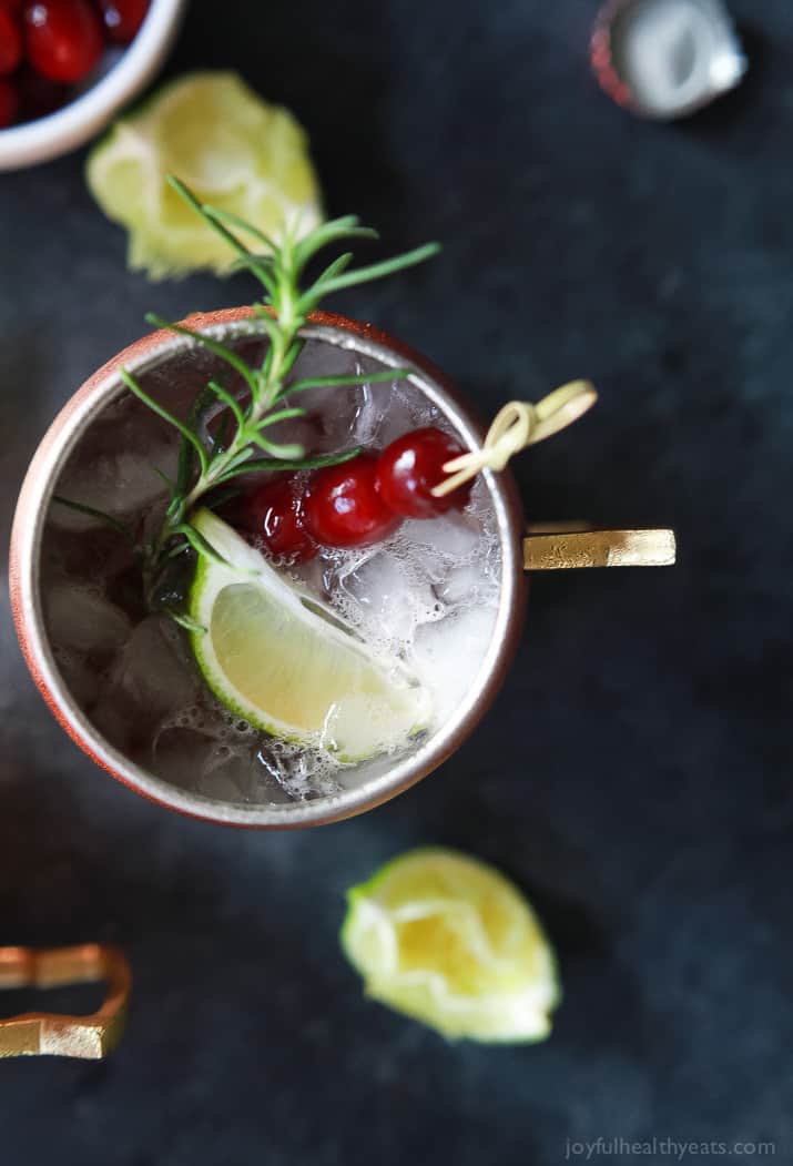 Top view of a cranberry Moscow mule mug with a lime wedge.