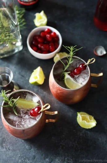 Cranberry Moscow Mule with Rosemary Infused Vodka, you'll love this holiday twist on a classic and so will you're guests! Light, refreshing, and filled with holiday cheer! | joyfulhealthyeats.com #recipes