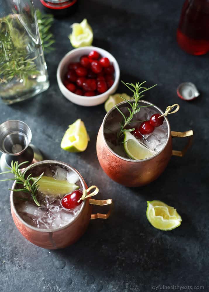 Top view of two mugs of Cranberry Moscow Mule with Rosemary Infused Vodka