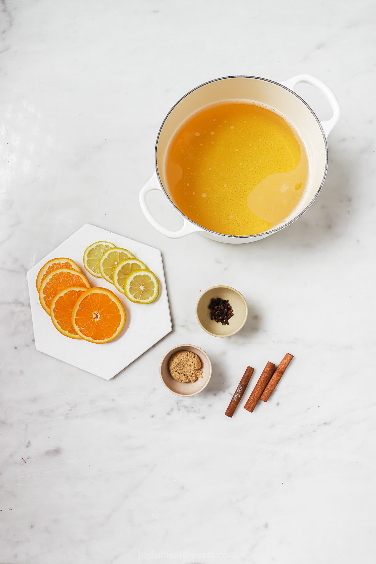 Ingredients for crockpot hot apple cider. 