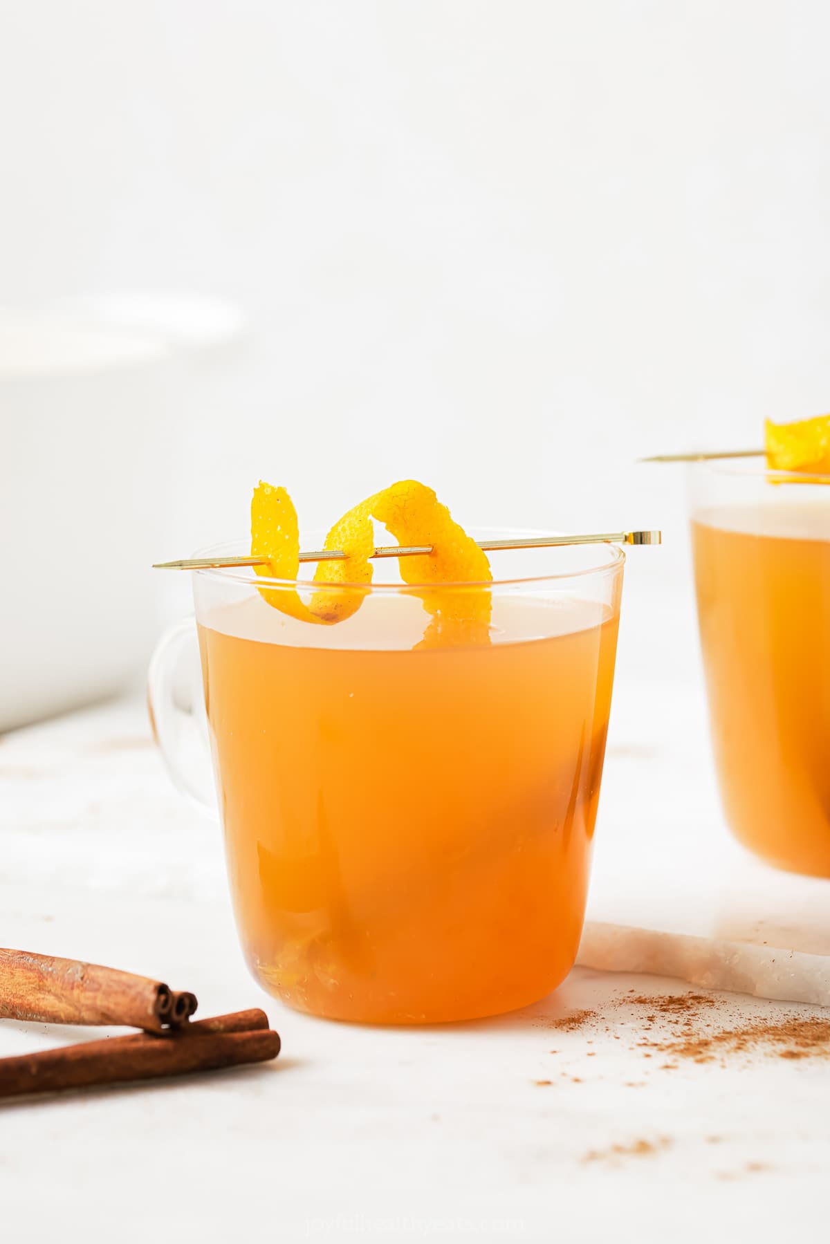 Crockpot apple cider in a serving glass. 