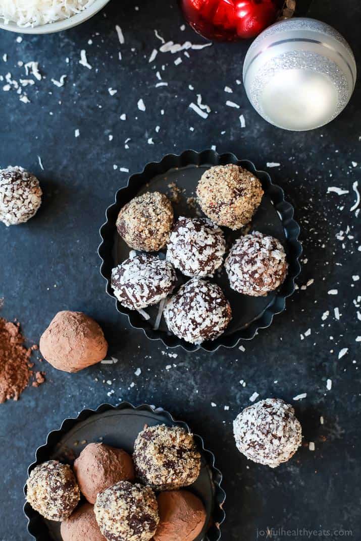 Top view of round Chocolate Truffles coated with nuts, cocoa, coconut