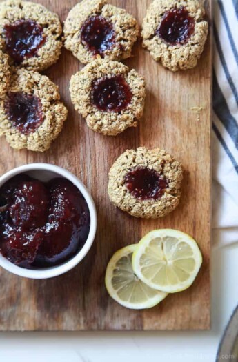 You're only 10 ingredients away from these amazing Flourless Lemon Raspberry Thumbprint Cookies! Not only are these a must on the Holiday Cookie list but they are guilt free too! Sooo good! | joyfulhealthyeats.com