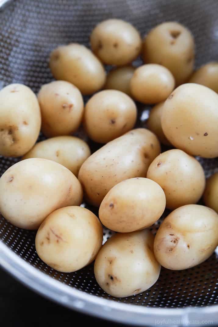 Small white potatoes in a colander
