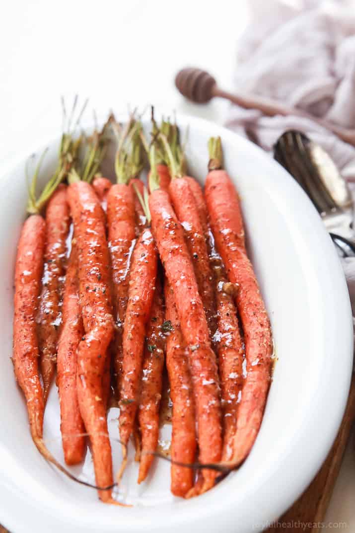 A white bowl filled with Glazed Carrots 