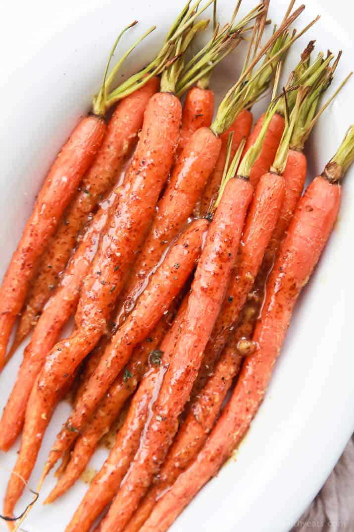 A bunch of Glazed Carrots sitting in a white bowl