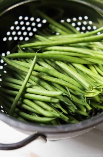 Green Beans in a metal collander.