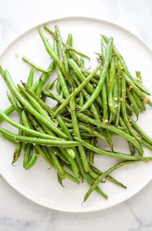 Plate of skillet green beans with garlic.