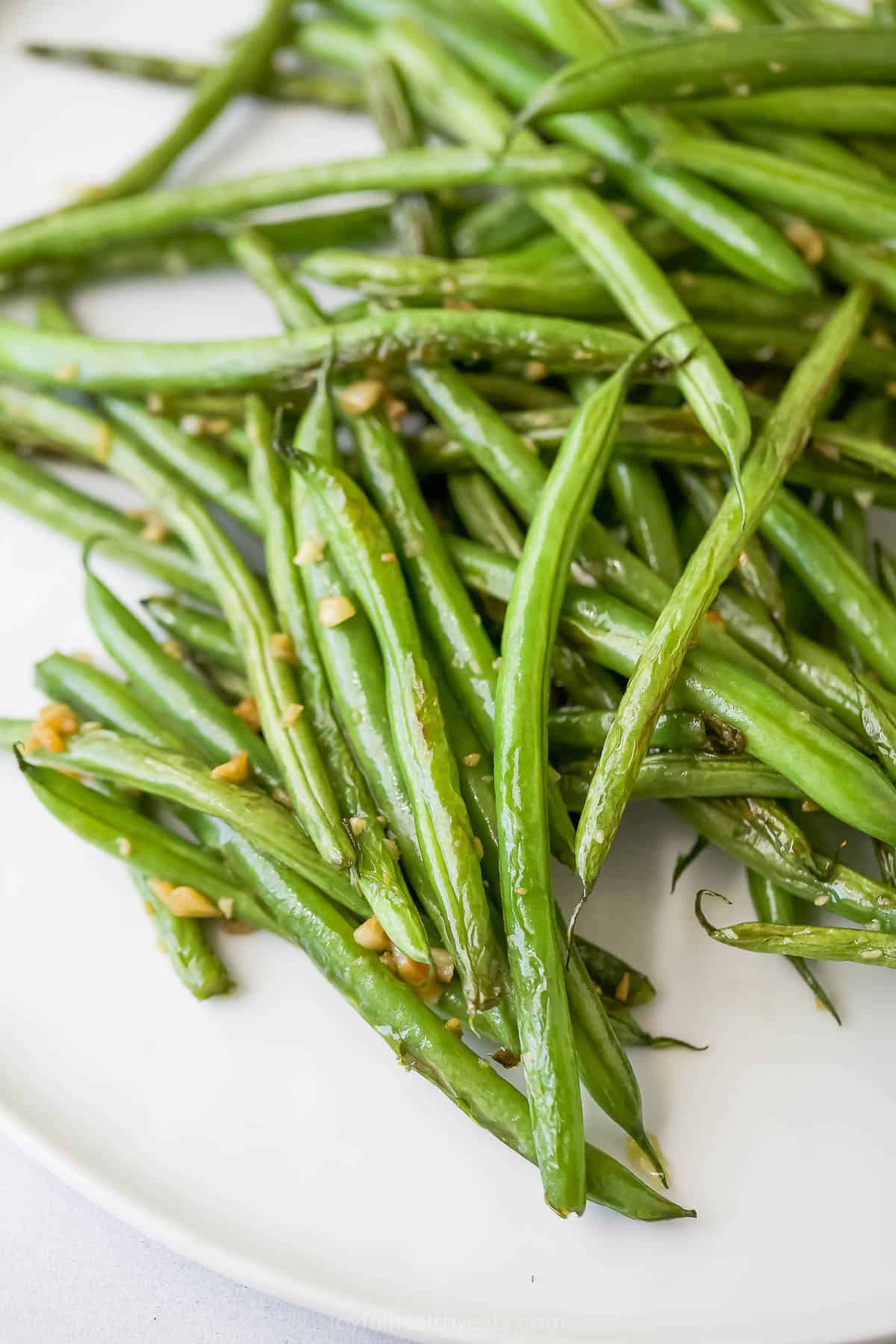 Garlicky skillet green beans on plate.