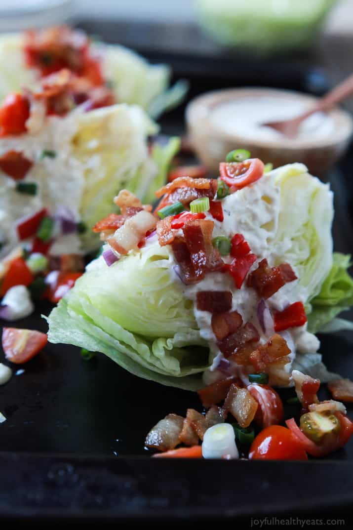 Close-up of Classic Wedge Salad with Blue Cheese Dressing with crumbled bacon