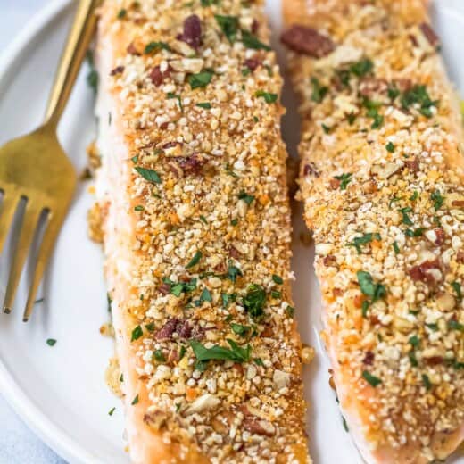Pecan crusted salmon filets on a plate.
