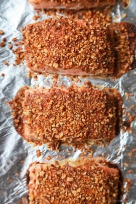 honesty mustard pecan crusted salmon on a baking sheet