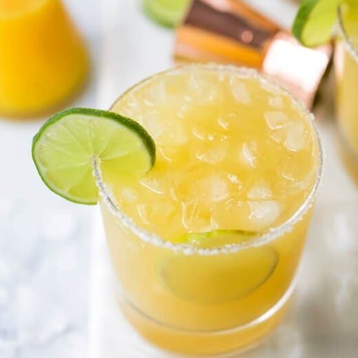 close up photo of a glass filled with a classic margarita