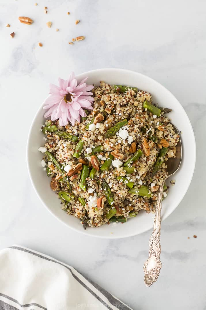 light creamy goat cheese asparagus quinoa salad in a bowl