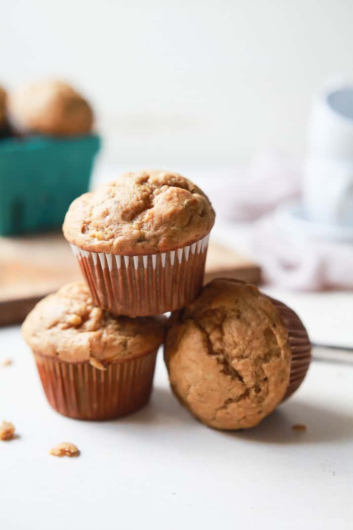 Spiced Chai Banana Muffins with a secret ingredient for an extra nutritional boost. These muffins are butter free, refined sugar free, crazy moist, and absolutely delicious. You and your kids will fall in love! | joyfulhealthyeats.com