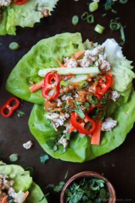 Thai Chicken Lettuce Wraps - made from scratch with chicken, fresh ginger, cilantro, fresh vegetables and slathered with a Spicy Peanut Sauce. This quick easy recipe is ready in just 20 minutes and to die for! | joyfulhealthyeats.com #glutenfree