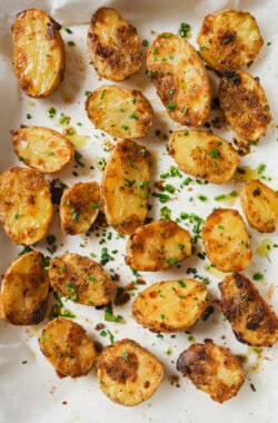 Garlic ranch potatoes in the baking tray sprinkled with parsley.