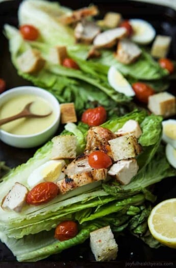 Grilled Chicken Caesar Salad with a Light Caesar Dressing that is egg and anchovy free! This Salad takes 15 minutes to make, is 289 calories a serving, and you can't beat that dynamite grill flavor infused throughout this dish! | joyfulhealthyeats.com Easy Dinner Ideas