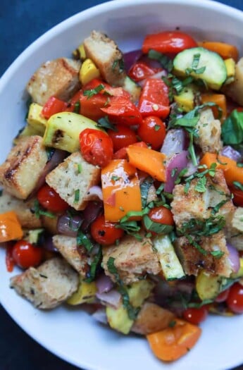 An incredible Grilled Vegetable Panzanella Salad filled with crunchy ciabatta bread, charred vegetables, fresh basil, and sweet balsamic vinaigrette! This salad, is light, refreshing, and totally swoon worthy! | joyfulhealthyeats.com