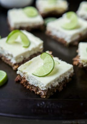 A few Easy Key Lime Cheesecake Bars made lighter with Greek yogurt and a delicious cinnamon pecan crust. This simple dessert is pure cheesecake perfection and guaranteed to win over the hearts of many! | joyfulhealthyeats.com