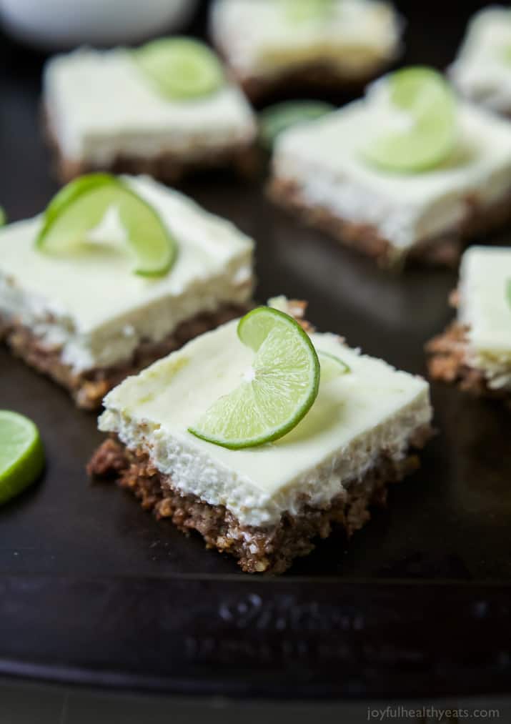 Easy Key Lime Cheesecake Bars made lighter with Greek yogurt and a delicious cinnamon pecan crust. This simple dessert is pure cheesecake perfection and guaranteed to win over the hearts of many! | joyfulhealthyeats.com