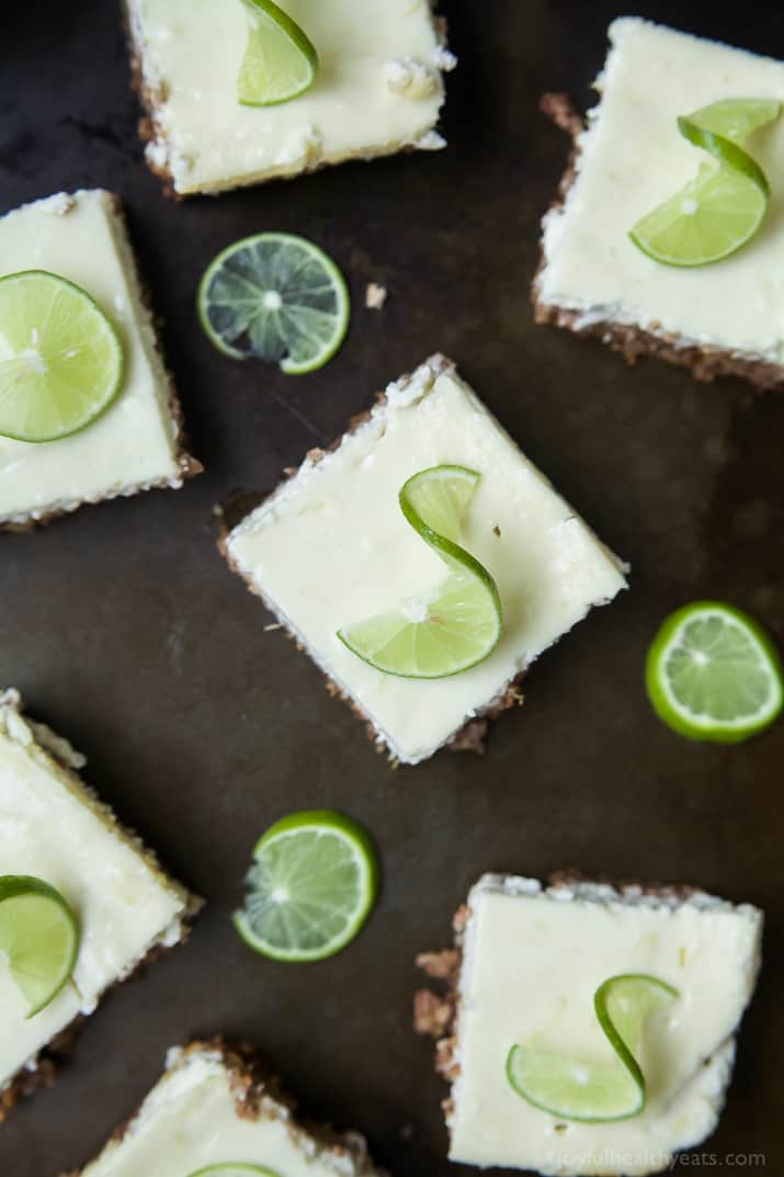 Easy Key Lime Cheesecake Bars made lighter with Greek yogurt and a delicious cinnamon pecan crust. This simple dessert is pure cheesecake perfection and guaranteed to win over the hearts of many! | joyfulhealthyeats.com