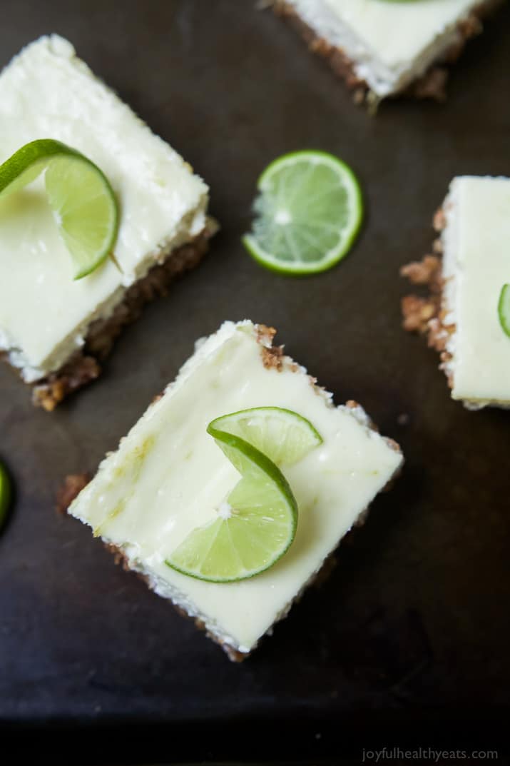 Easy Key Lime Cheesecake Bars made lighter with Greek yogurt and a delicious cinnamon pecan crust. This simple dessert is pure cheesecake perfection and guaranteed to win over the hearts of many! | joyfulhealthyeats.com