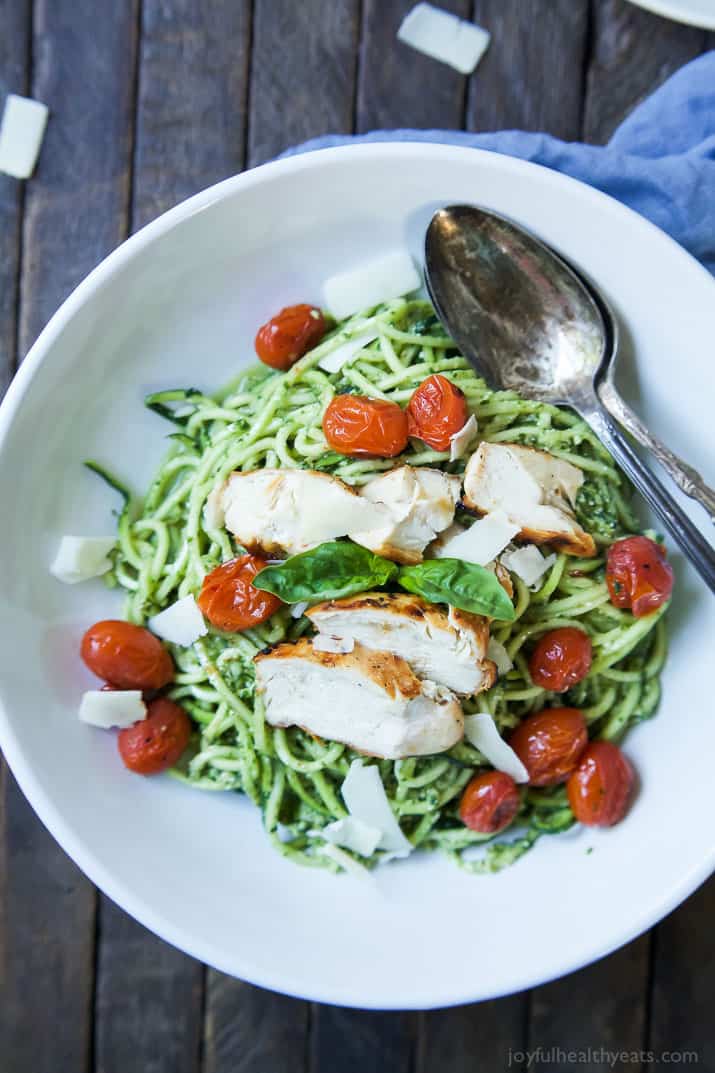 An easy dinner recipe for a busy week, and no stove needed! Pesto Chicken Zoodles with Burst Tomatoes, full of bold flavors, high in protein, and in low carbs! Your family will love it! | joyfulhealthyeats.com