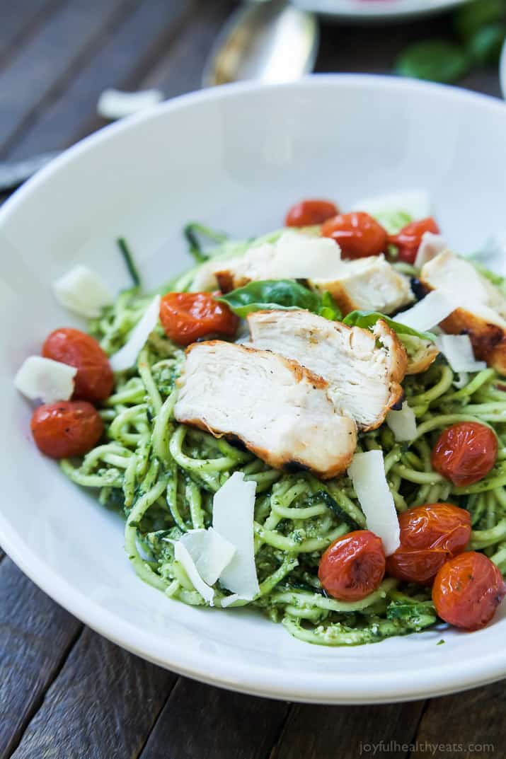 An easy dinner recipe for a busy week, and no stove needed! Pesto Chicken Zoodles with Burst Tomatoes, full of bold flavors, high in protein, and in low carbs! Your family will love it! | joyfulhealthyeats.com