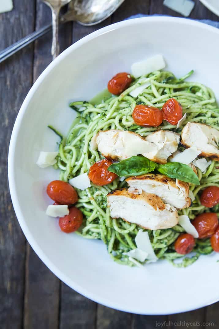 An easy dinner recipe for a busy week, and no stove needed! Pesto Chicken Zoodles with Burst Tomatoes, full of bold flavors, high in protein, and in low carbs! Your family will love it! | joyfulhealthyeats.com