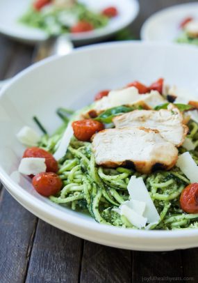 An easy dinner recipe for a busy week, and no stove needed! Pesto Chicken Zoodles with Burst Tomatoes, full of bold flavors, high in protein, and in low carbs! Your family will love it! | joyfulhealthyeats.com