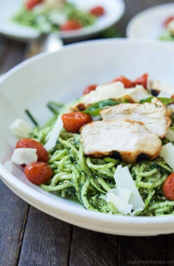 An easy dinner recipe for a busy week, and no stove needed! Pesto Chicken Zoodles with Burst Tomatoes, full of bold flavors, high in protein, and in low carbs! Your family will love it! | joyfulhealthyeats.com