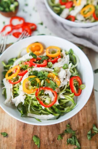 Thai Chicken Zucchini Noodle Salad with a Sesame Vinaigrette done in 15 minutes and only 324 calories. This salad is served cold with raw zucchini noodles, it is refreshing, light, filled with bold flavors and perfect for the summer! | joyfulhealthyeats.com #glutenfree