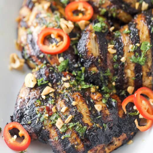 Grilled chicken with easy Asian-style marinade, chopped chilis, and cashews.