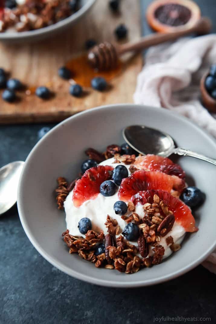 A healthy and Light Yogurt Breakfast Bowl filled with pops of flavor from sweet blood orange and tart blueberries then finished with homemade Vanilla Granola! You'll never want another breakfast again! | joyfulhealthyeats.com