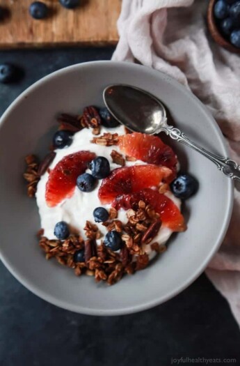 A healthy and Light Yogurt Breakfast Bowl filled with pops of flavor from sweet blood orange and tart blueberries then finished with homemade Vanilla Granola! You'll never want another breakfast again! | joyfulhealthyeats.com