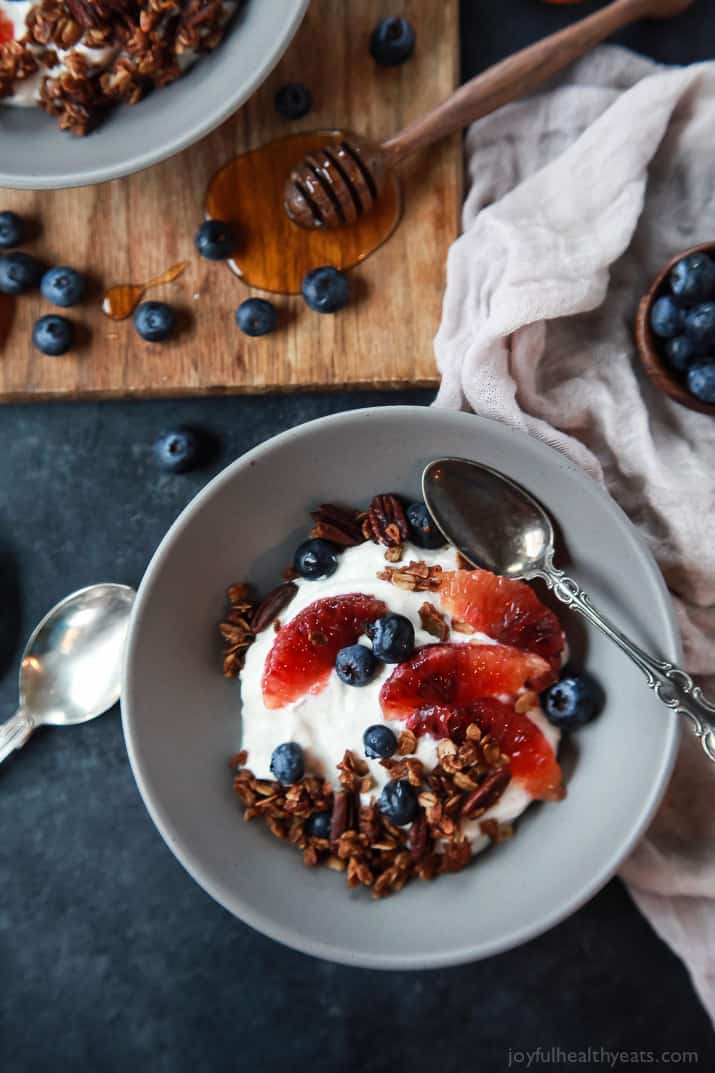 A healthy and Light Yogurt Breakfast Bowl filled with pops of flavor from sweet blood orange and tart blueberries then finished with homemade Vanilla Granola! You'll never want another breakfast again! | joyfulhealthyeats.com