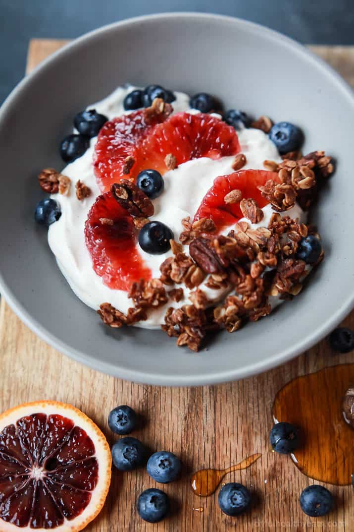 A healthy and Light Yogurt Breakfast Bowl filled with pops of flavor from sweet blood orange and tart blueberries then finished with homemade Vanilla Granola! You'll never want another breakfast again! | joyfulhealthyeats.com